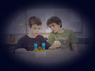 Children playing with coding bricks